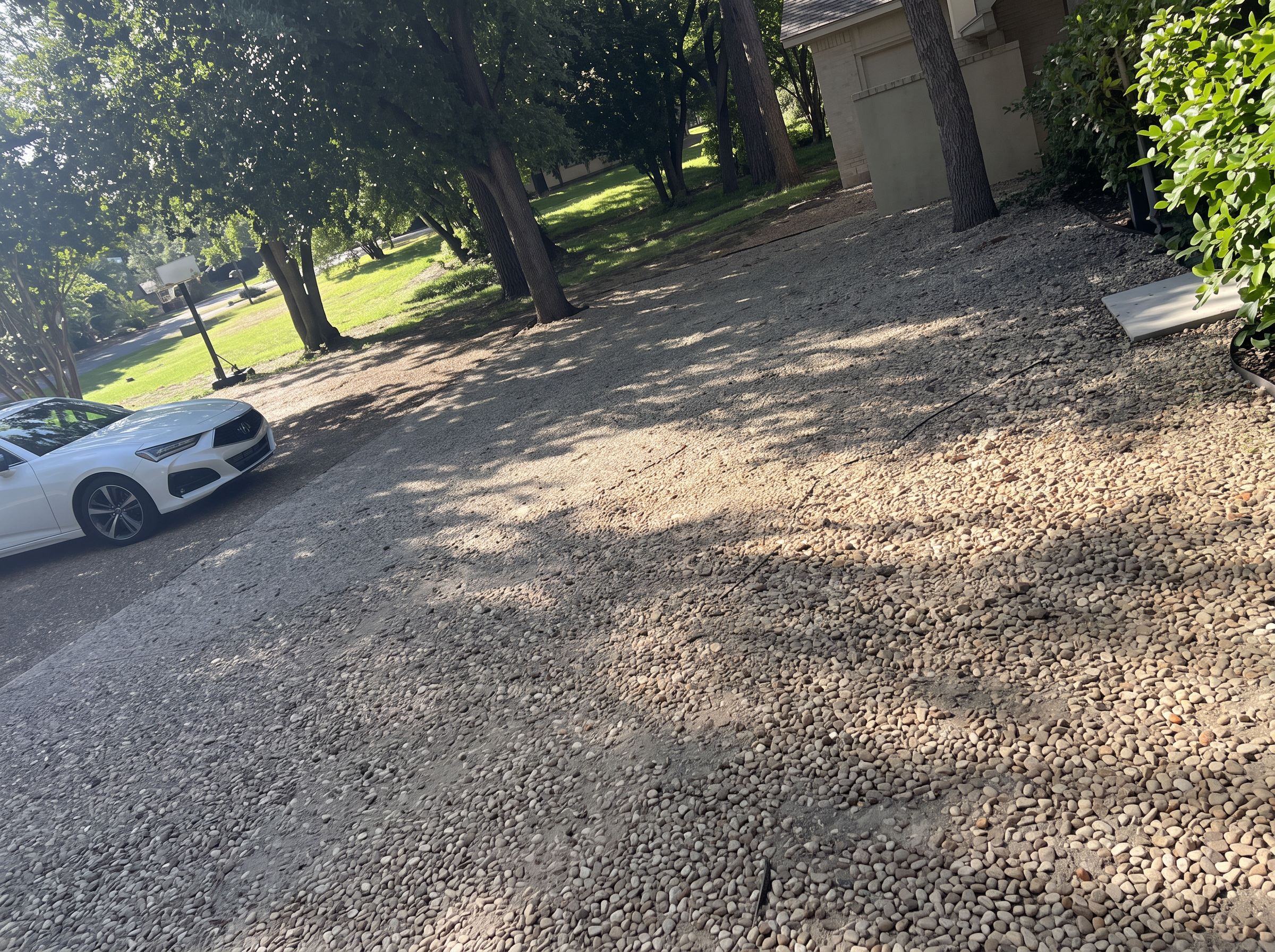 Shaded gravel driveway project completed by Austin Yard Oasis in Austin, TX