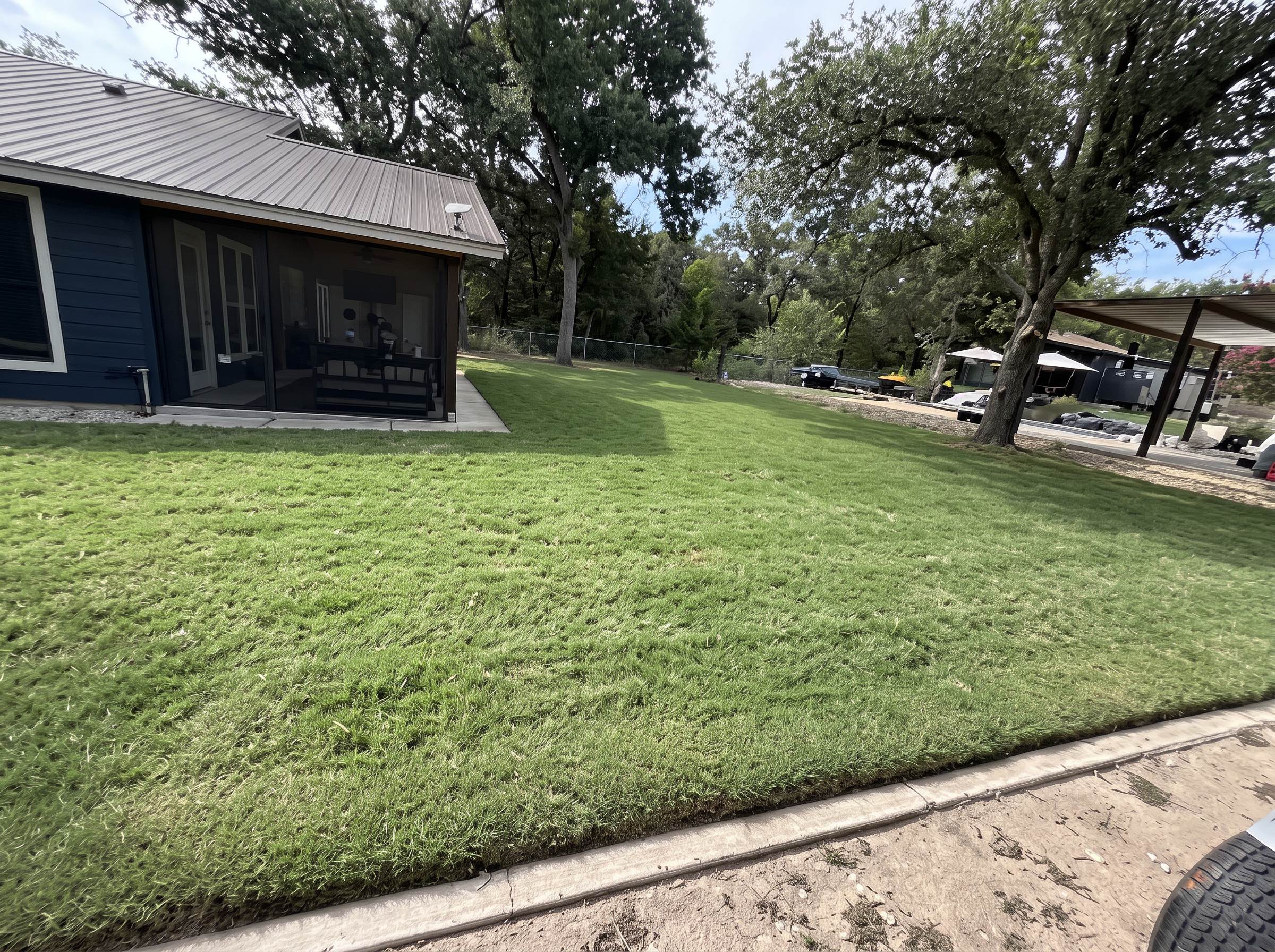 Corner lot lawn mowing project completed by Austin Yard Oasis in Austin, TX
