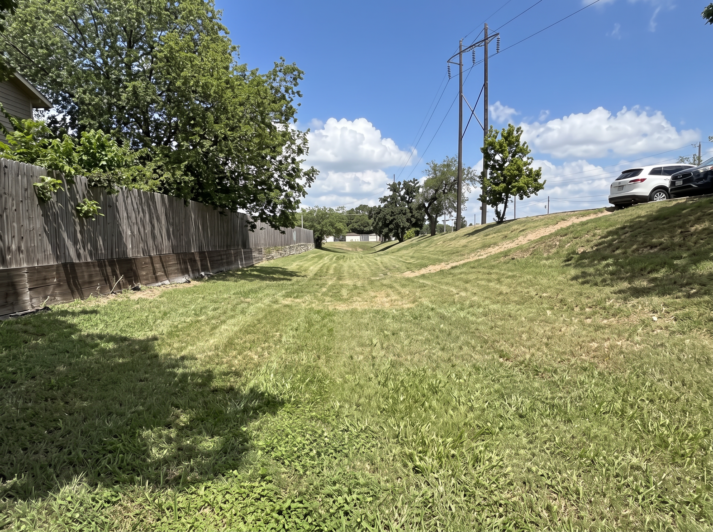 Sloped lawn mowing project completed by Austin Yard Oasis in Austin, TX