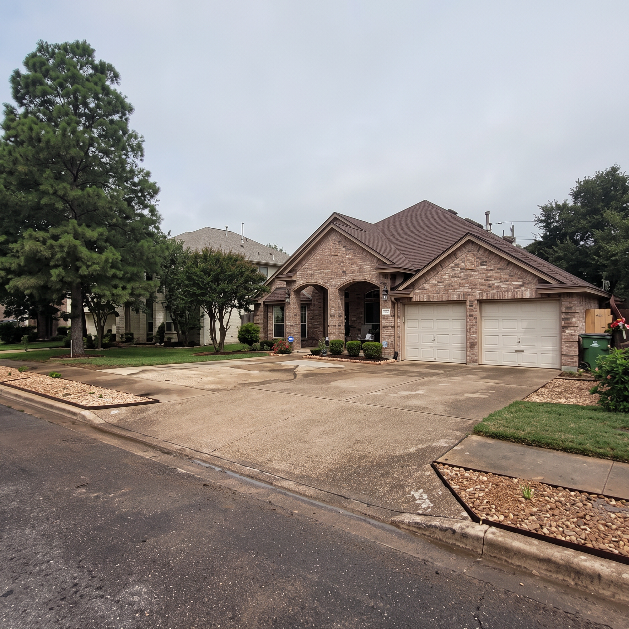 Residential driveway landscaping project completed by Austin Yard Oasis in Austin, TX