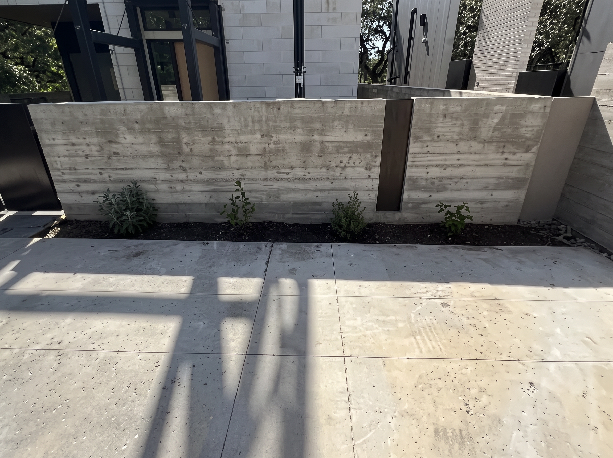 Modern concrete landscaping project completed by Austin Yard Oasis in Austin, TX