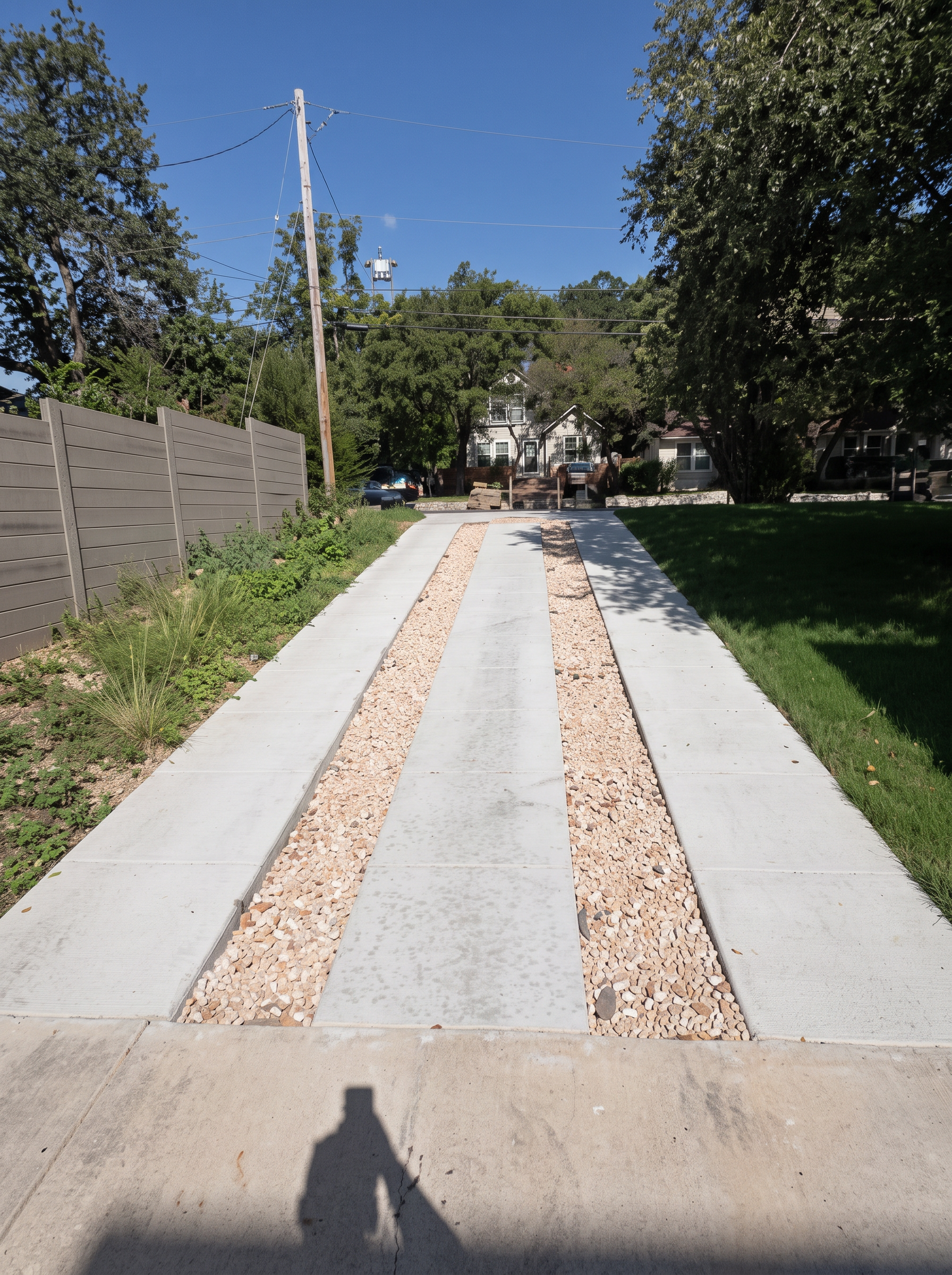 Concrete walkway gravel edging project completed by Austin Yard Oasis in Austin, TX